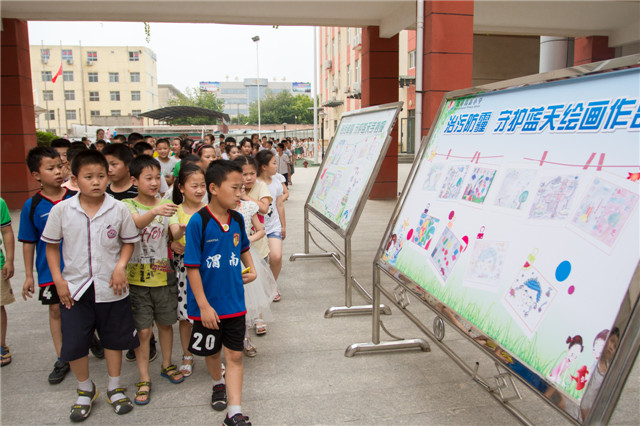 高新小学治污降霾手操报.jpg